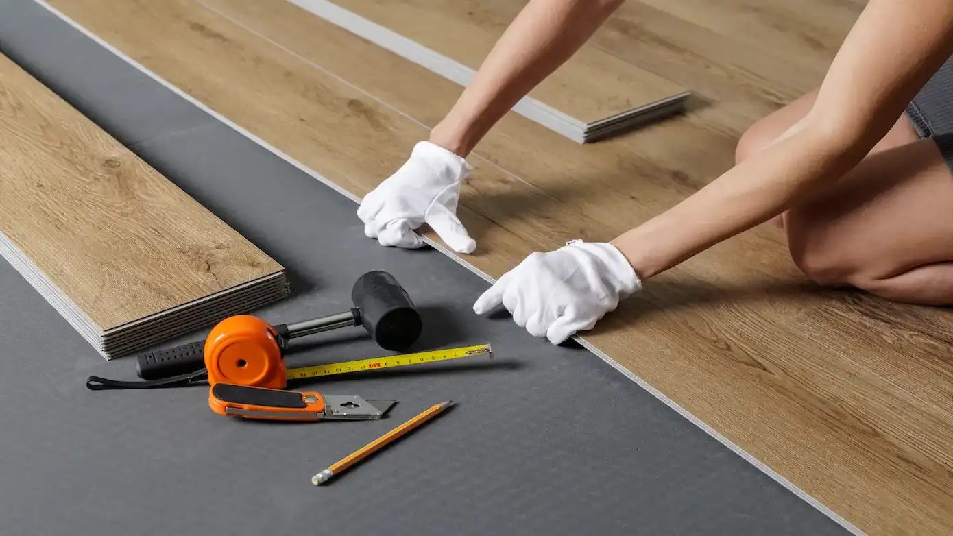 hands aligning spc vinyl plank